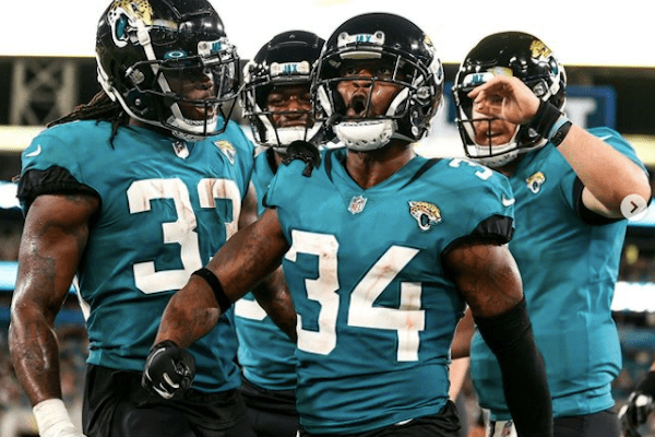 Jaguars players celebrating after a touchdown at a game